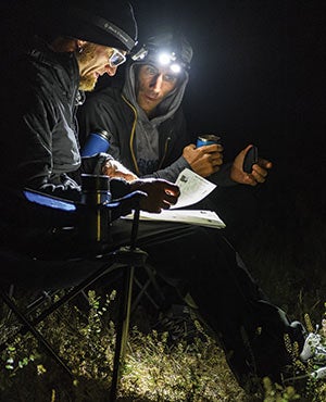 The author and Haynes study the map of day 2's route at the basecamp above Five Bar.