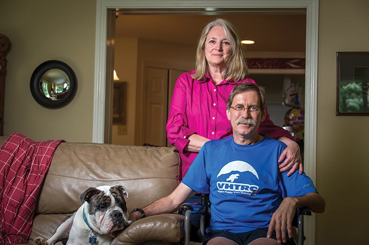 Runner Tom Green at home with his wife after an accident.