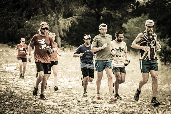 Chad Prichard (left, foreground) practices trail running and builds friendships at the Team RWB trail-running camp near Rock Springs, Texas, October 2015.