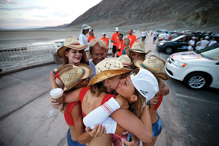 Shannon (white cap) hugs her team before attempting her sixth finish of the Badwater 135, in 2013. Photo by Lucy Nicholson/Reuters