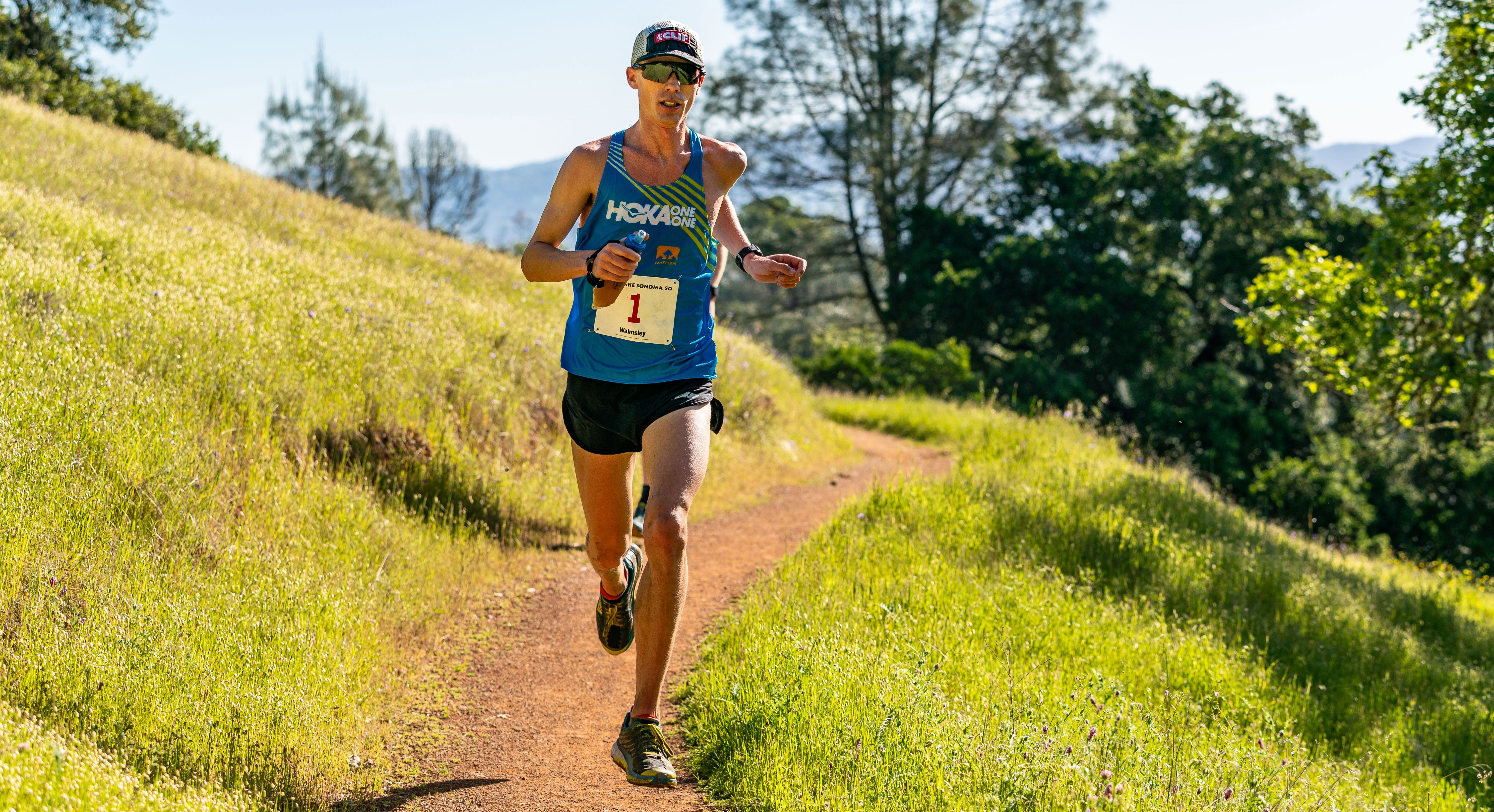 Jim Walmsley gliding in first place on California single track. Photo by Howie Stern.