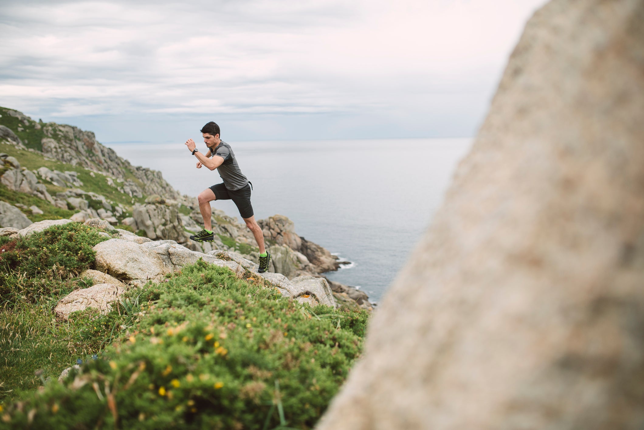 Trail runner in coastal landscape, Ferrol, Spain