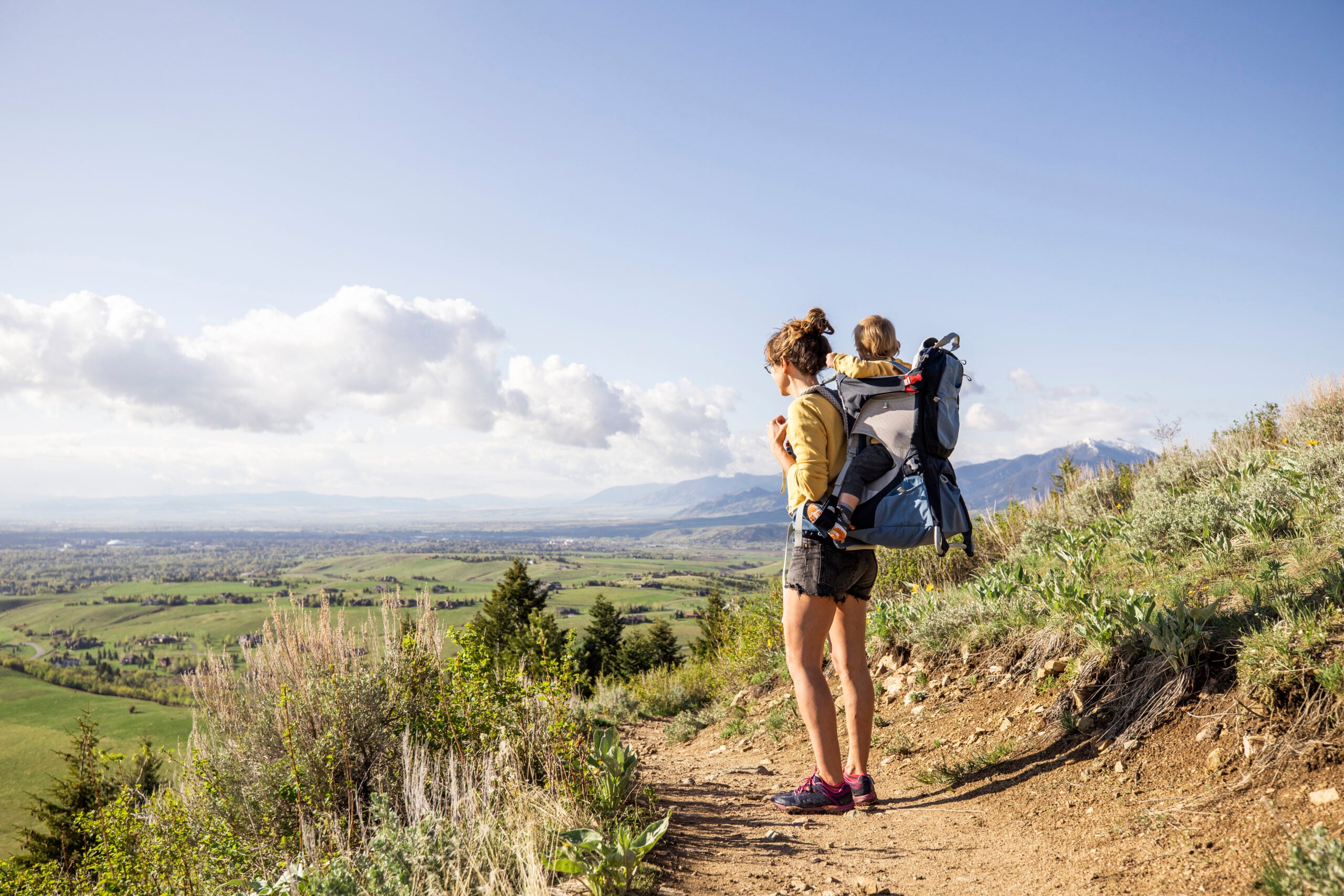 A mom and her young son hiking