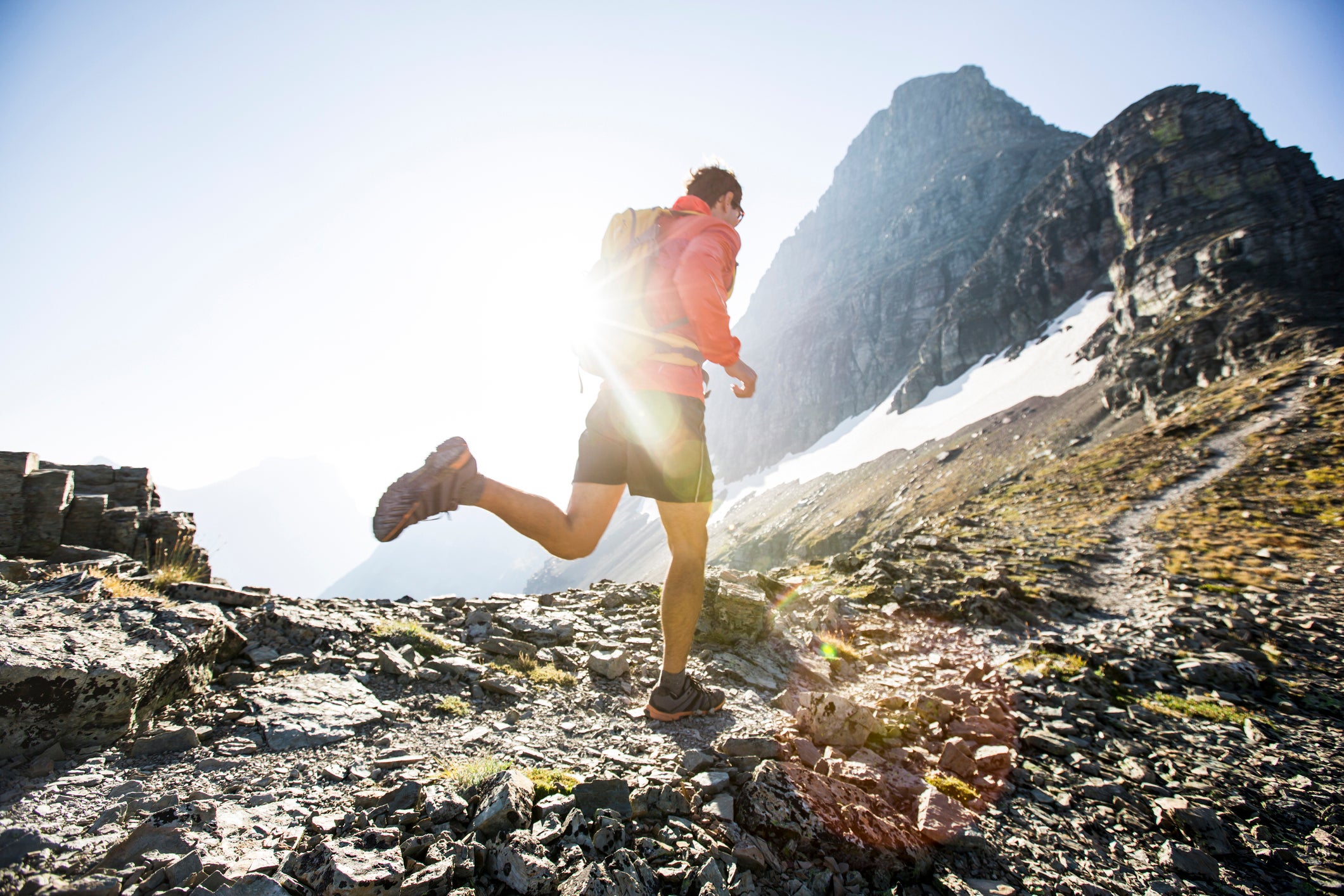 Trail running through the mountains of Glacier National Park.