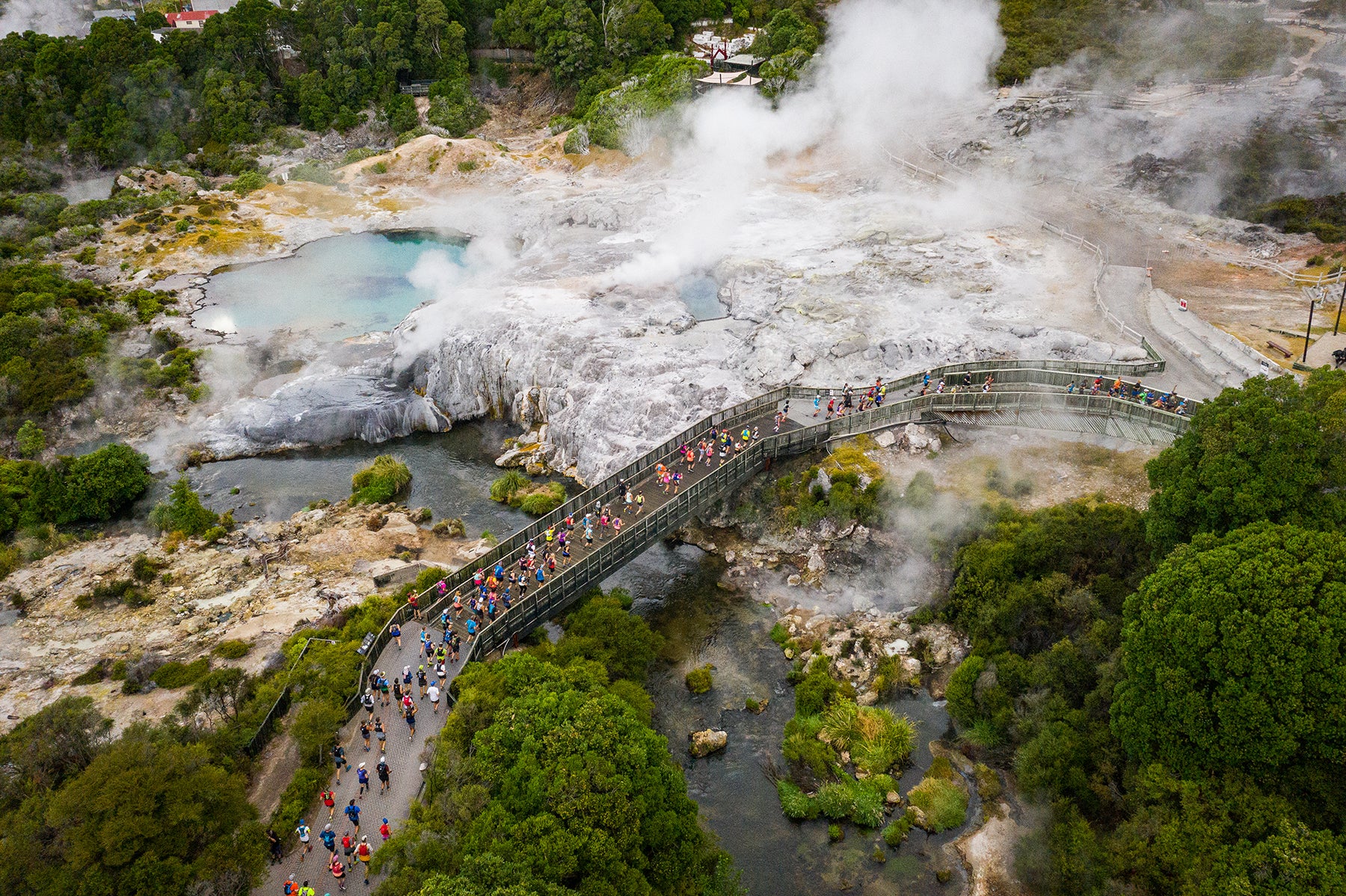 Runners making their way through the sulphur flats in Rotorua during the Tarawera Ultramarathon by UTMB